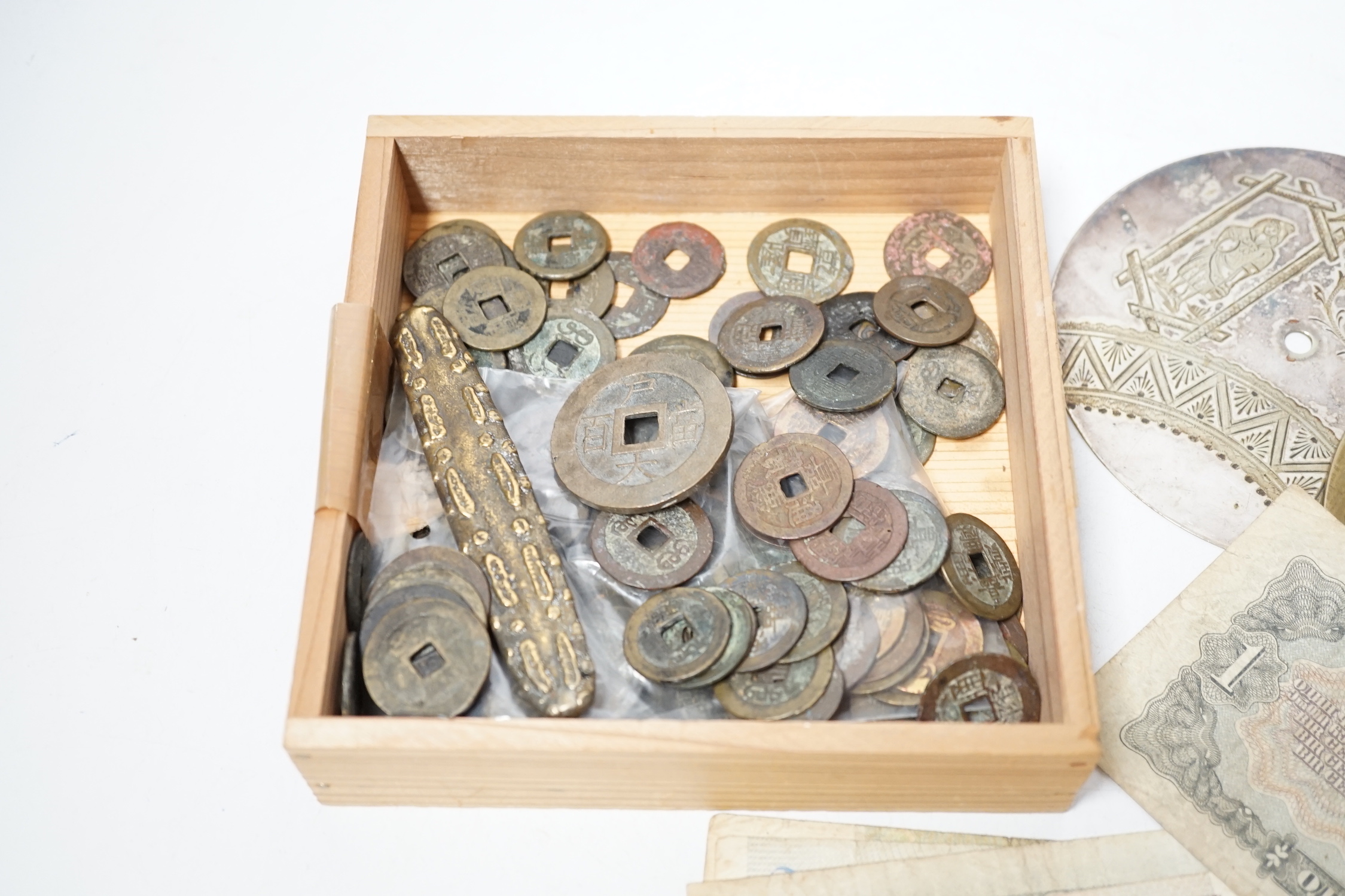 A group of Chinese tong bao cash coins, mostly Qianlong and Jiaqing and various World Bank notes including central bank of China 50 customs gold units and 20 customs gold unit